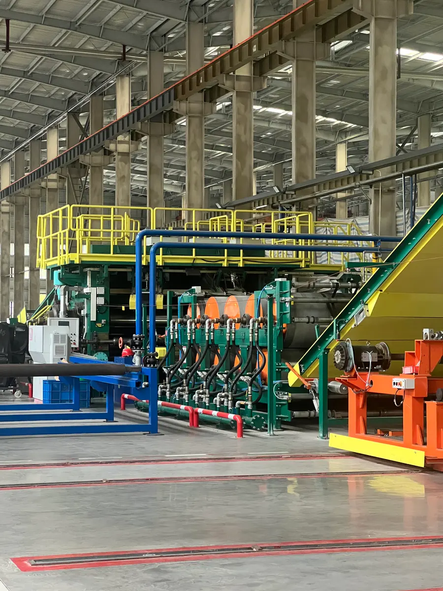 Workshop equipment with green frames, orange fittings and yellow-railed platforms